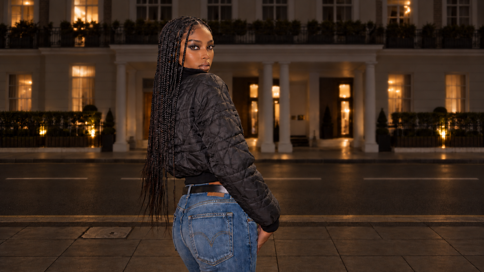 Nia Dlamini looking over her shoulder in a nighttime fashion scene